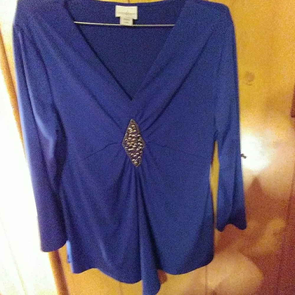 Sapphire blue blouse with gems in the neck line